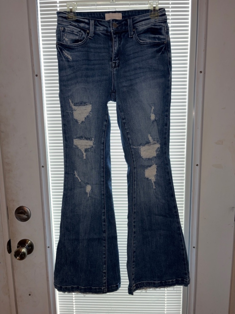 Distressed Flare Jeans in Deep Blue